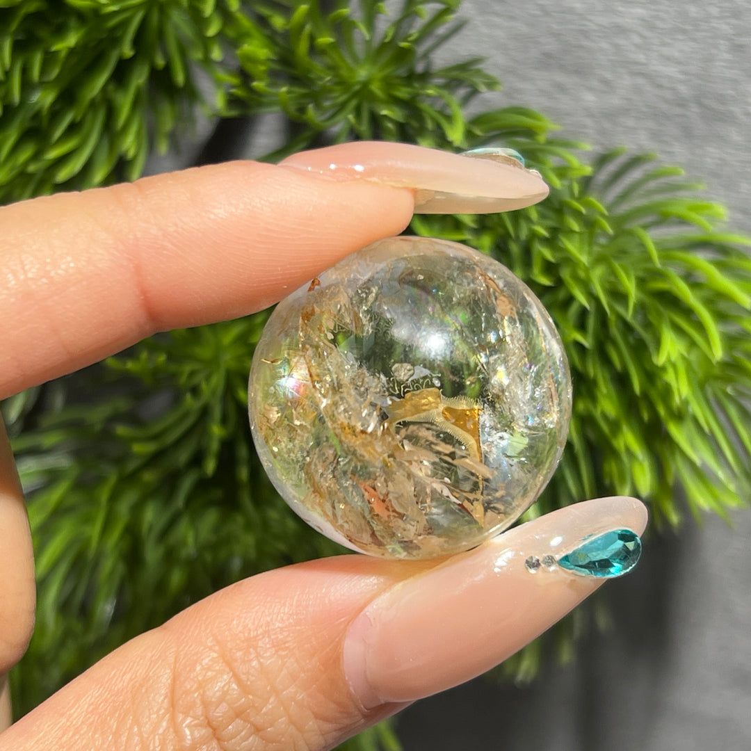Petroleum Included Quartz Sphere