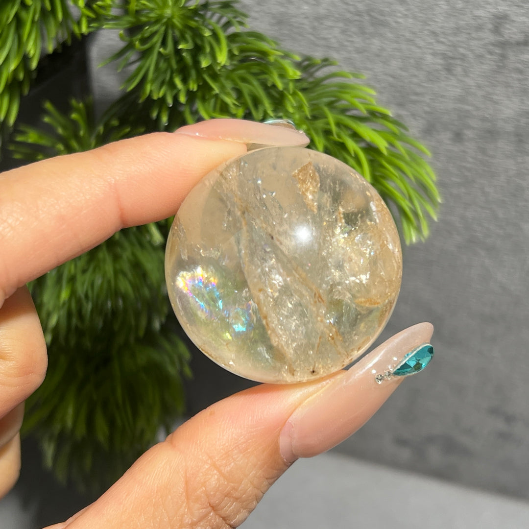 Petroleum Included Quartz Sphere