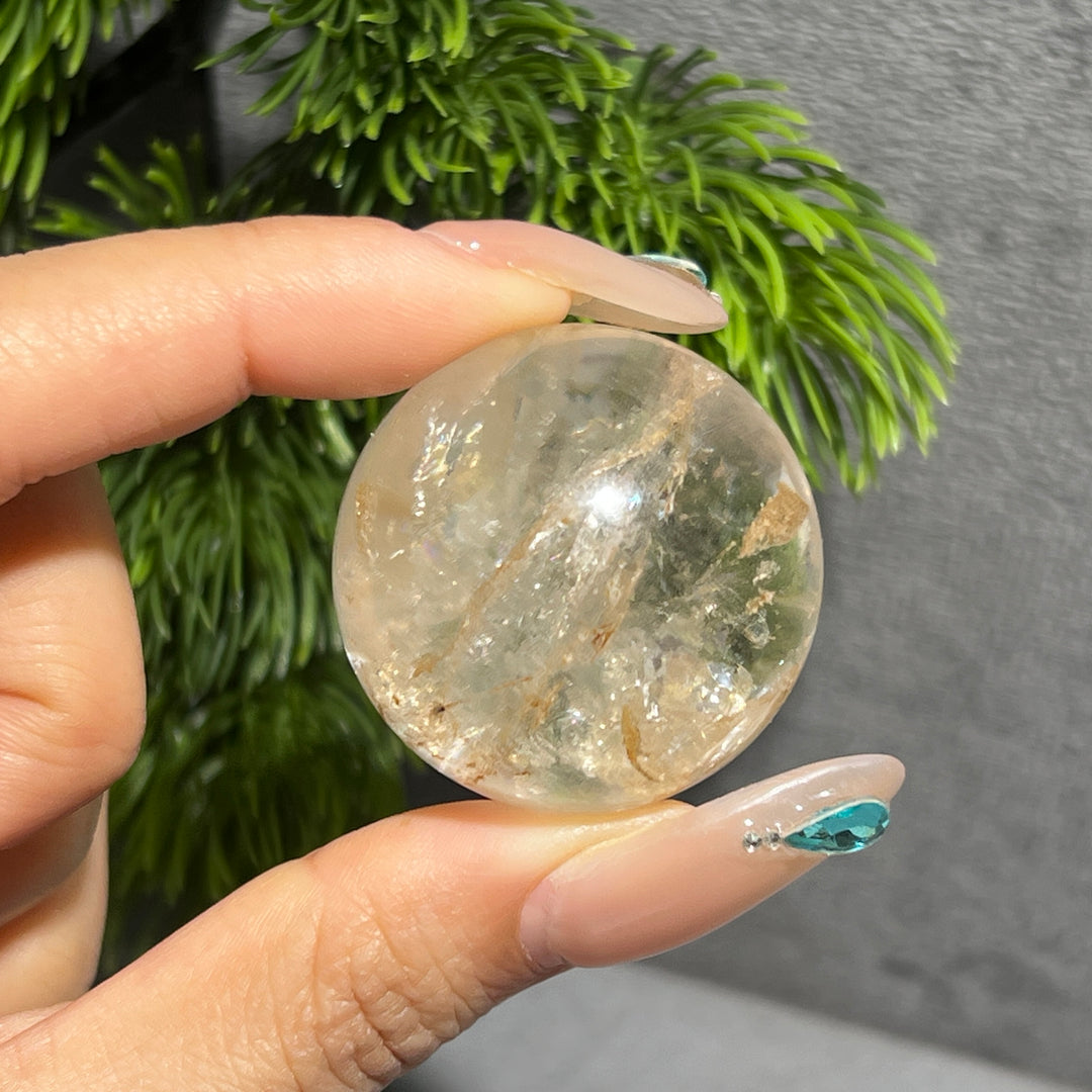 Petroleum Included Quartz Sphere
