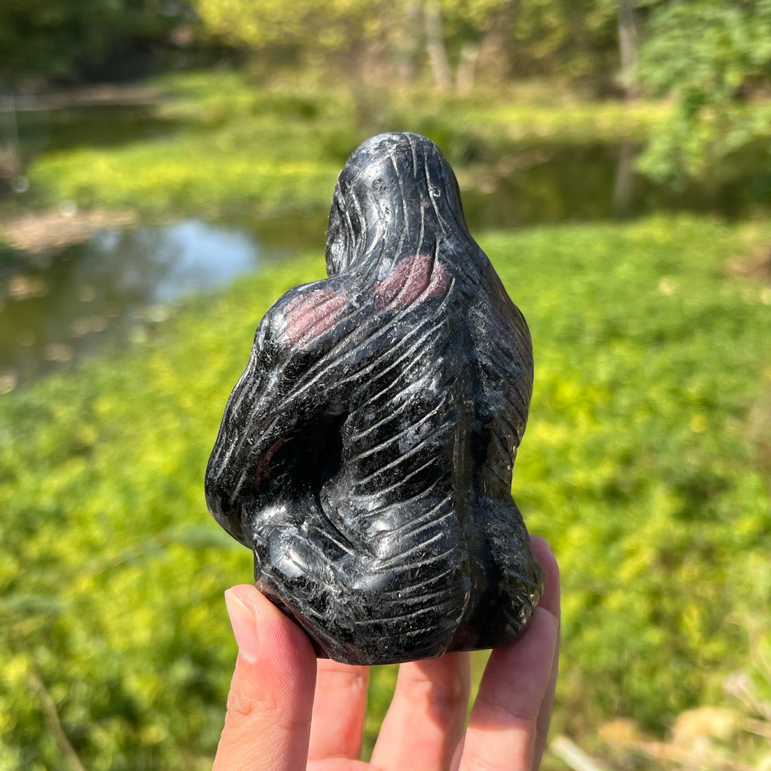 Garnet with Arfvedsonite and Astrophyllite Gorilla Carving