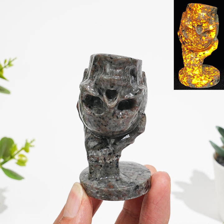 Natural Crystal Hand Holding Upside-Down Skull Carving