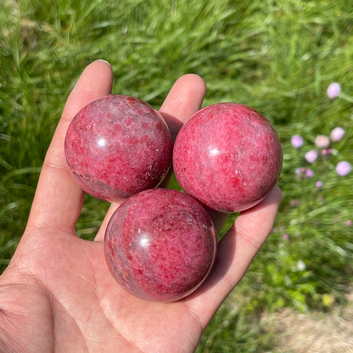 Natural Rhodonite In Quartz Sphere