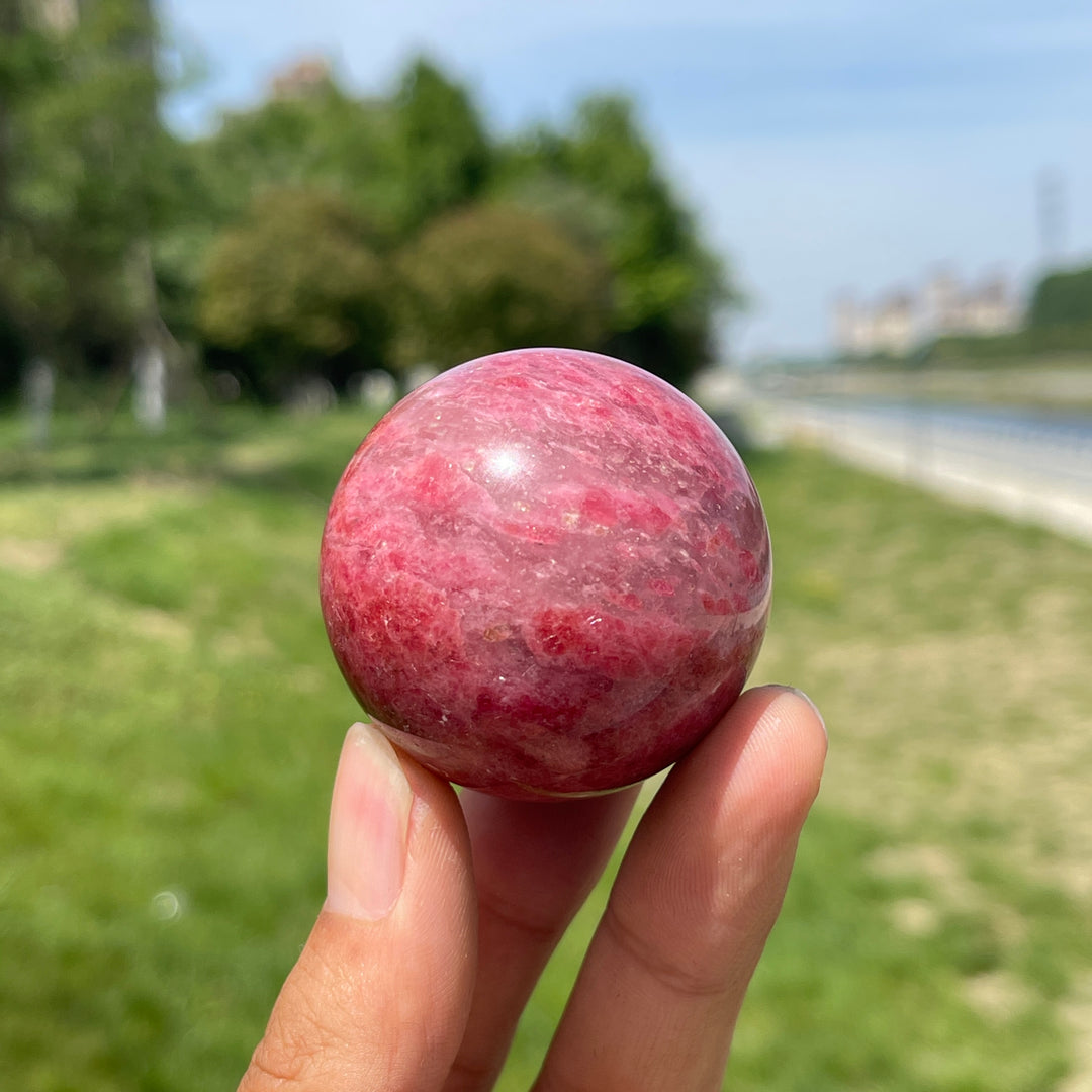 Natural Rhodonite In Quartz Sphere