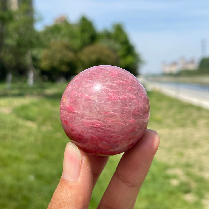 Natural Rhodonite In Quartz Sphere
