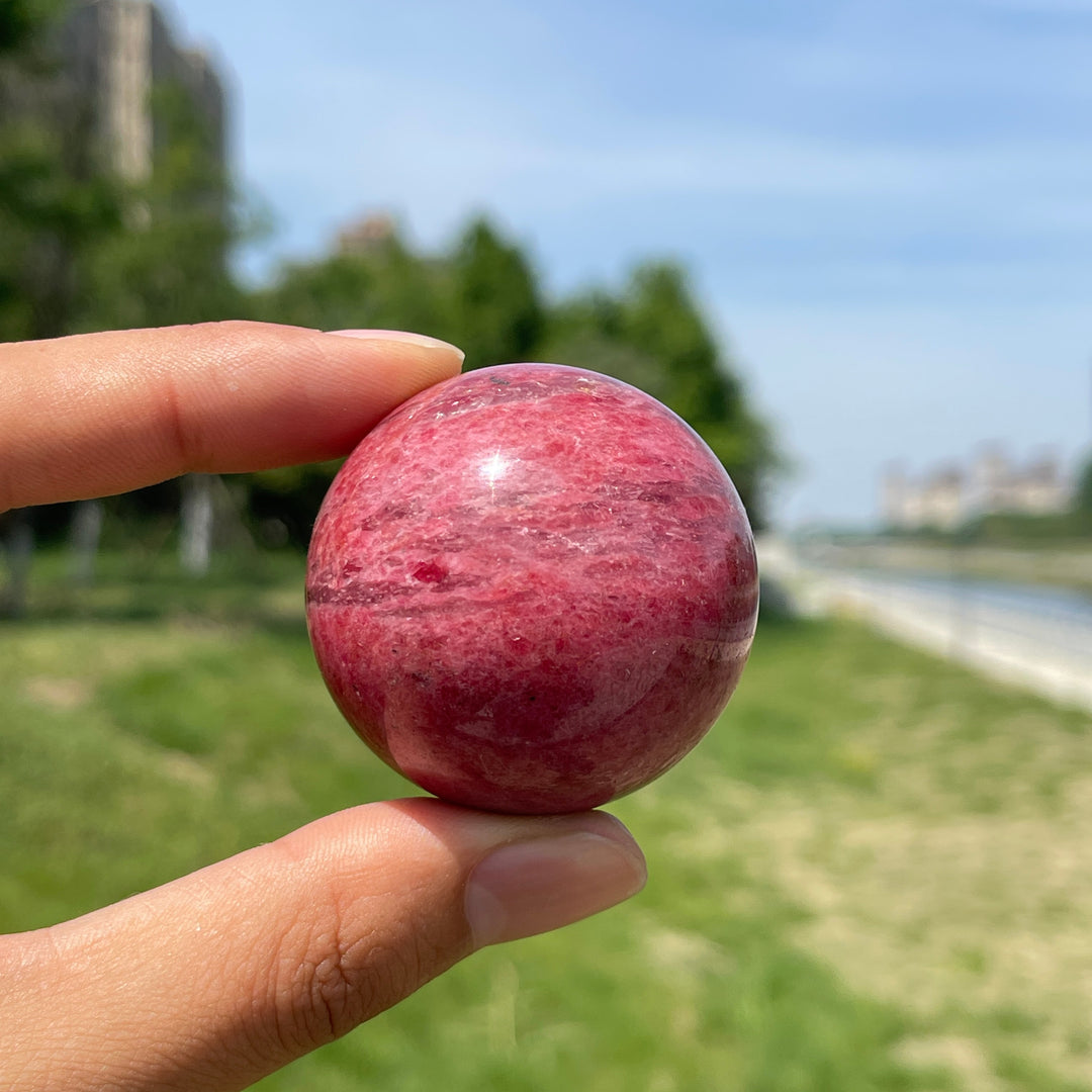 Natural Rhodonite In Quartz Sphere