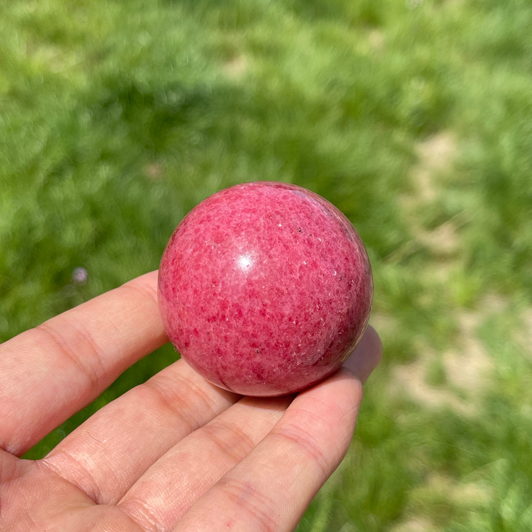 Natural Rhodonite In Quartz Sphere