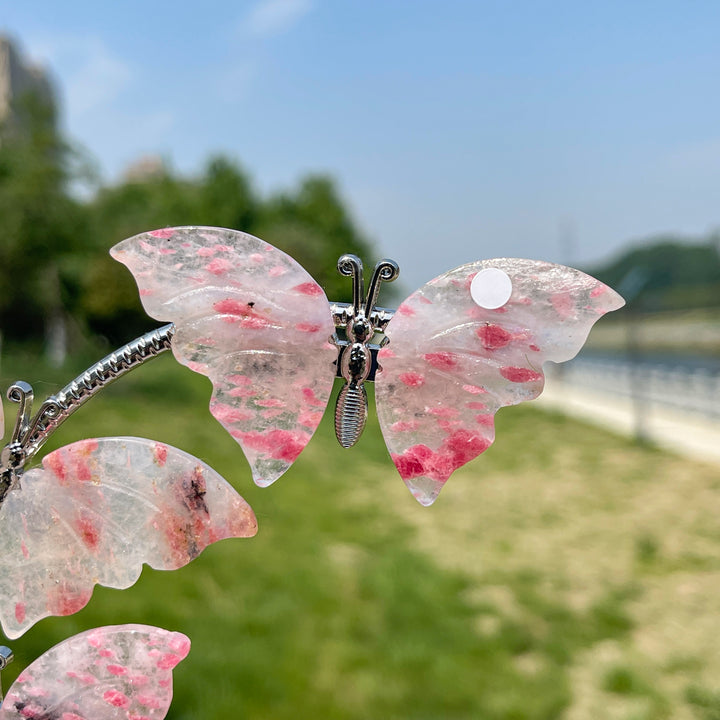 A Slightly Imperfect Natural Crystal Rhodonite In Quartz Butterfly Sphere Stand