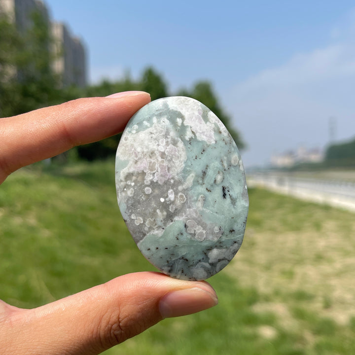 Natural Light Atlantisite Crystal Palm Stone