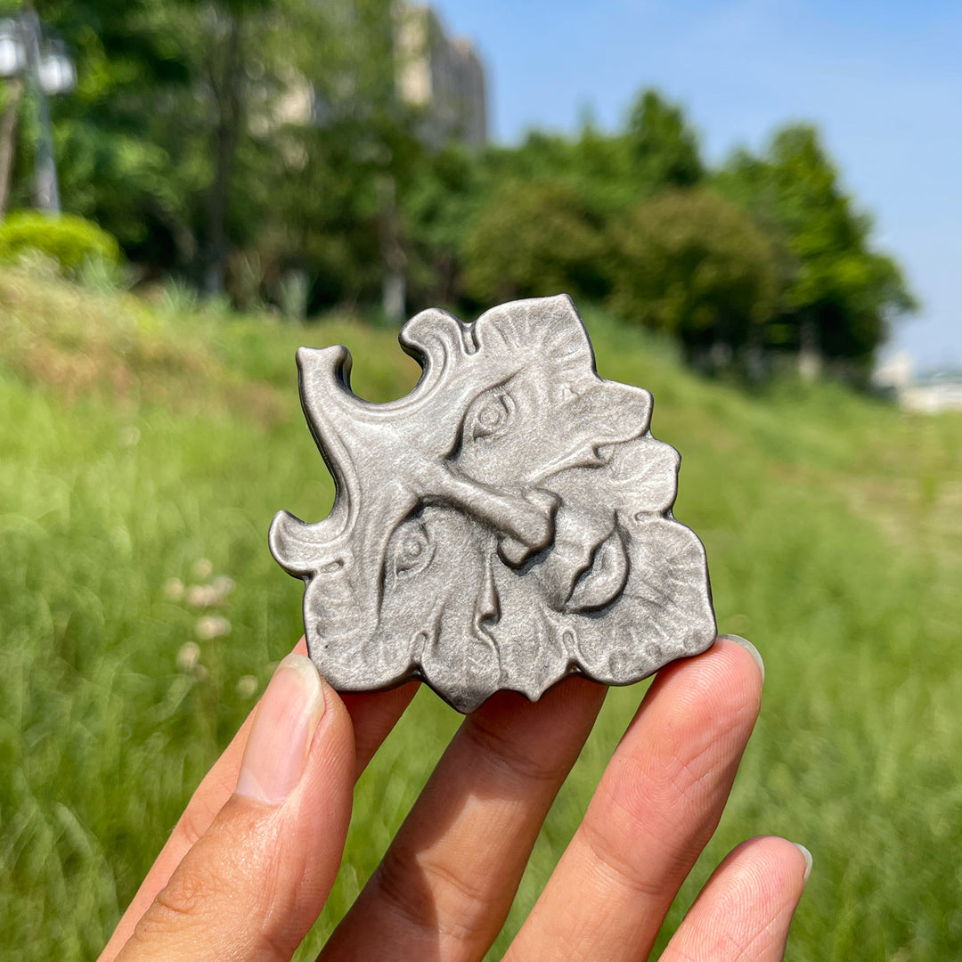 Natural Crystal Silver Obsidian Leaf Face Carving