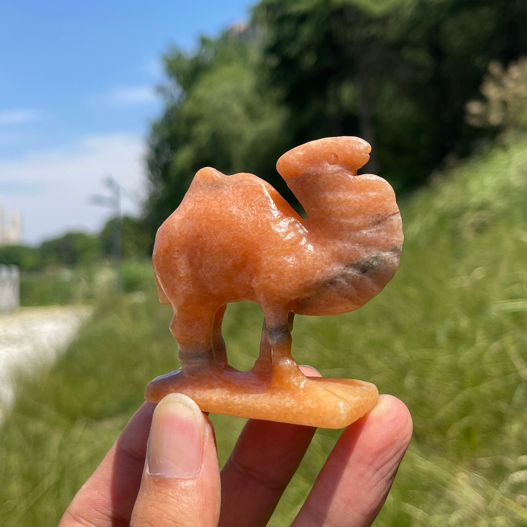 Natural Warm Orange Calcite Camel Carving