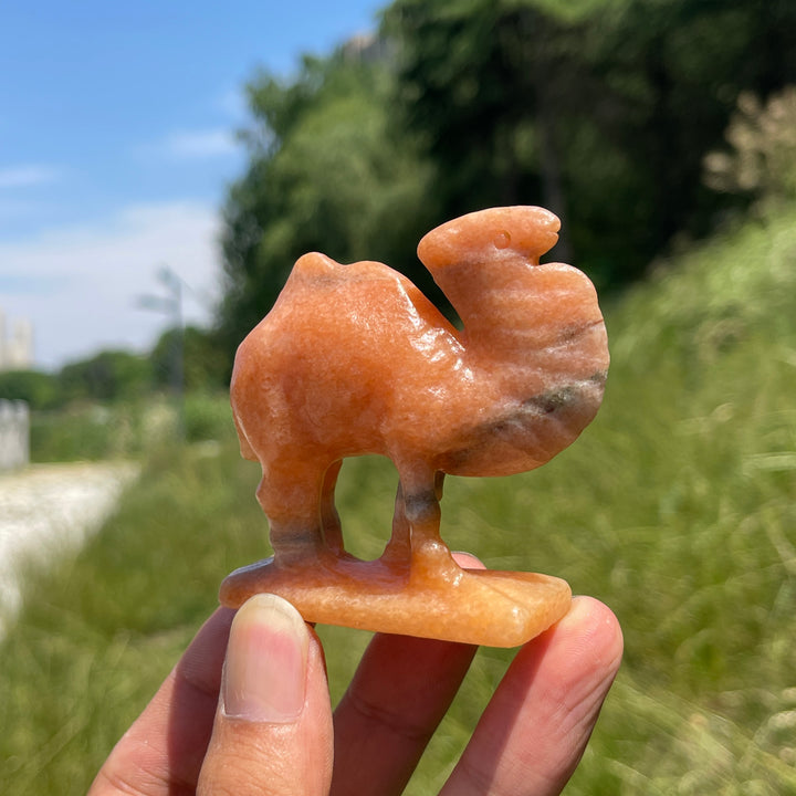 Natural Warm Orange Calcite Camel Carving
