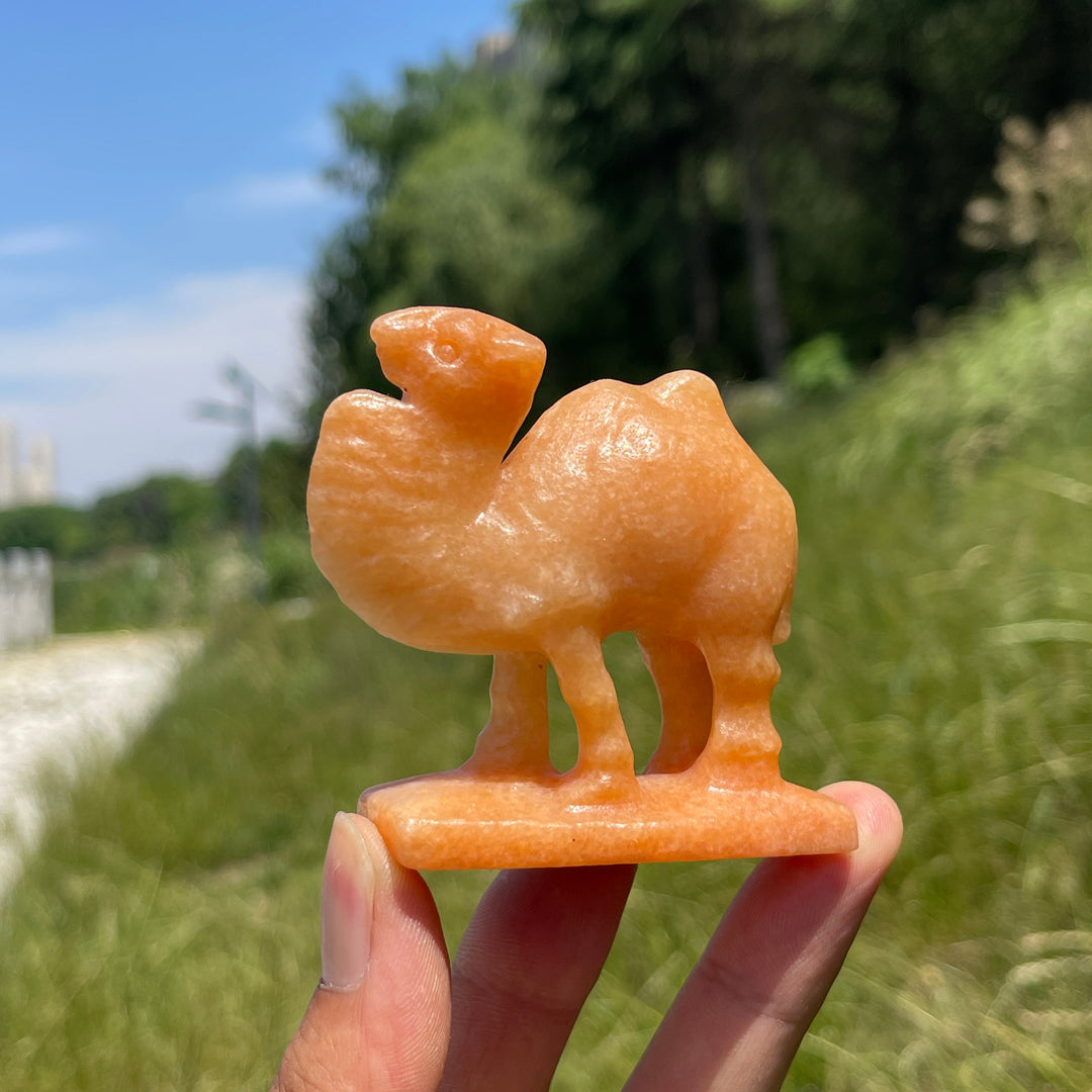 Natural Warm Orange Calcite Camel Carving