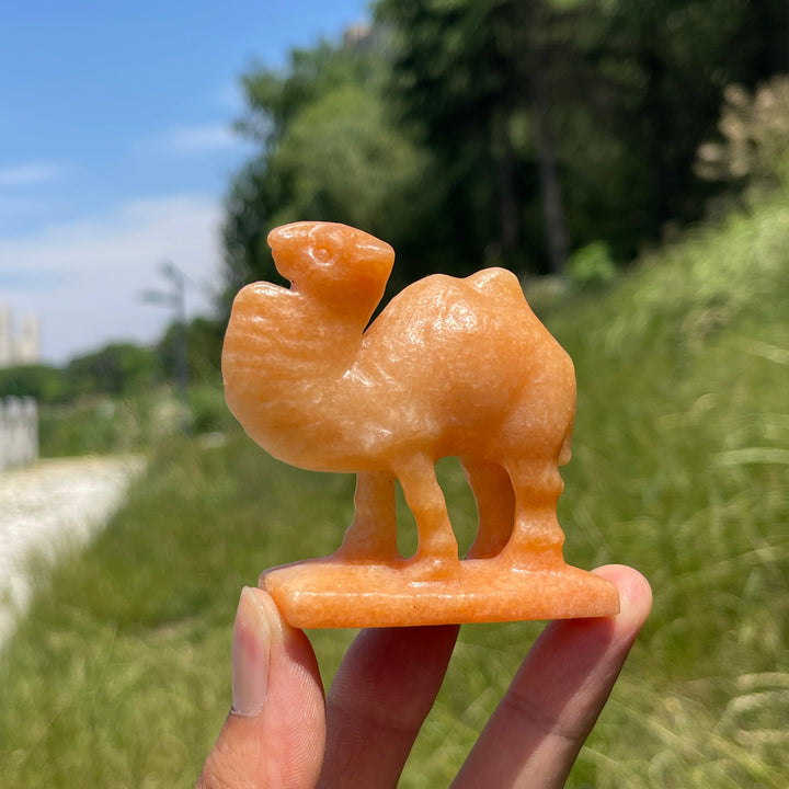 Natural Warm Orange Calcite Camel Carving