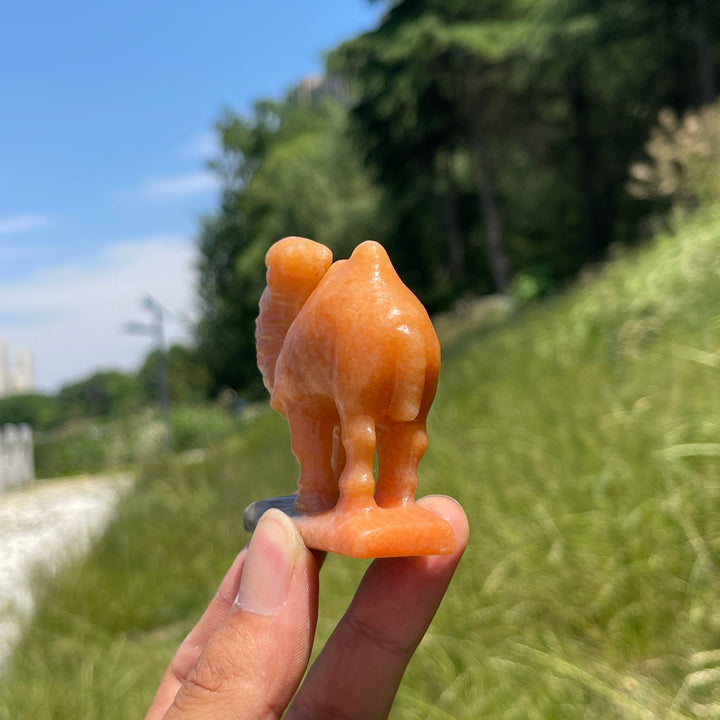 Natural Warm Orange Calcite Camel Carving