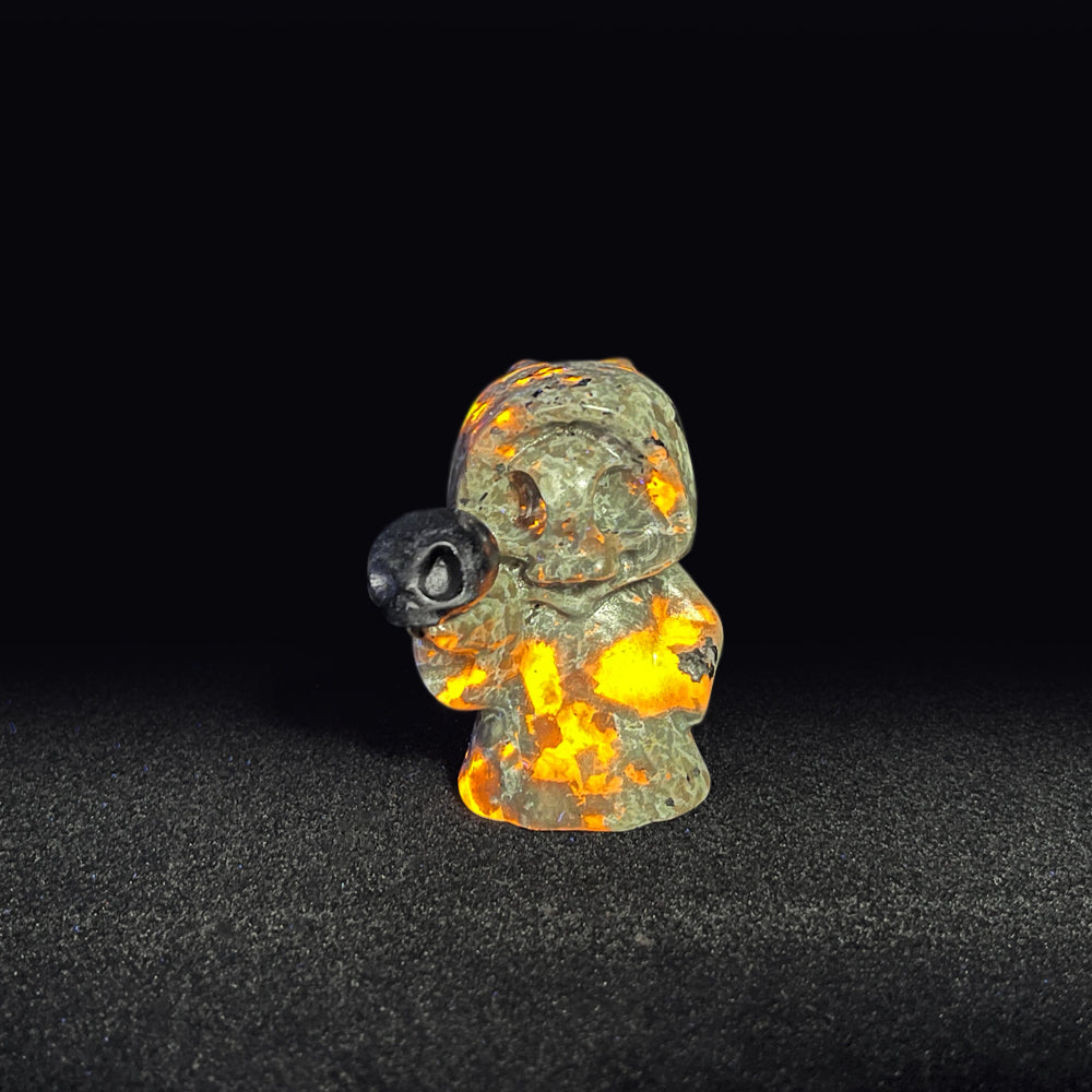 Natural Yooperlite Ghost Holding Skull Carving