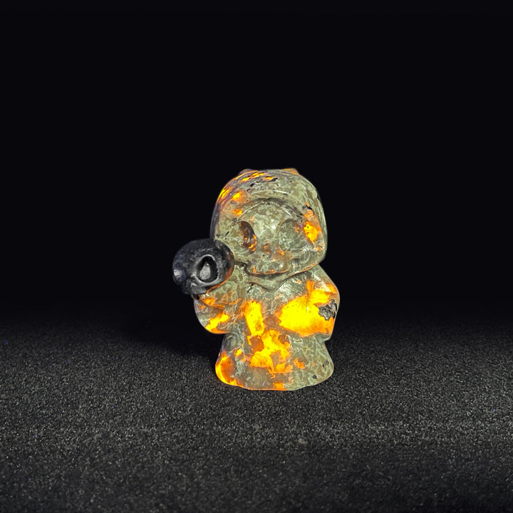 Natural Yooperlite Ghost Holding Skull Carving