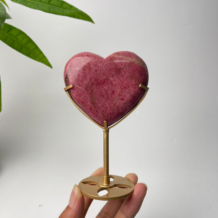 Unique,Natural Crystal Rhodonite In Quartz Heart With Stand