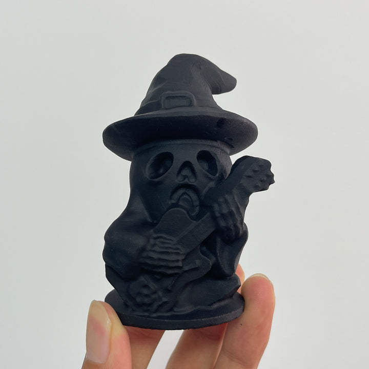 A Slightly Imperfect Natural Crystal Black Obsidian Guitar Playing Skull