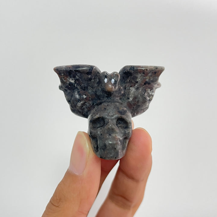 A Slightly Imperfect Natural Crystal Carving Skull With Cute Bat