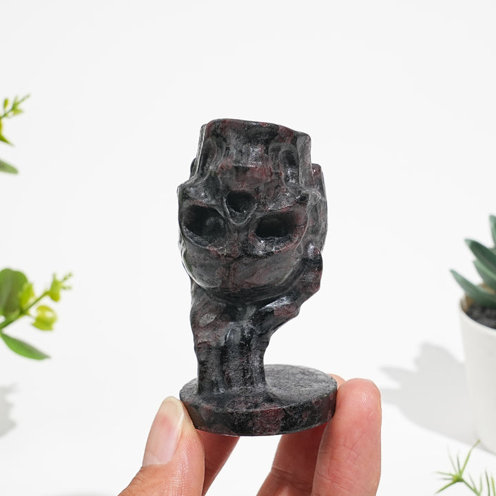 Natural Crystal Hand Holding Upside-Down Skull Carving