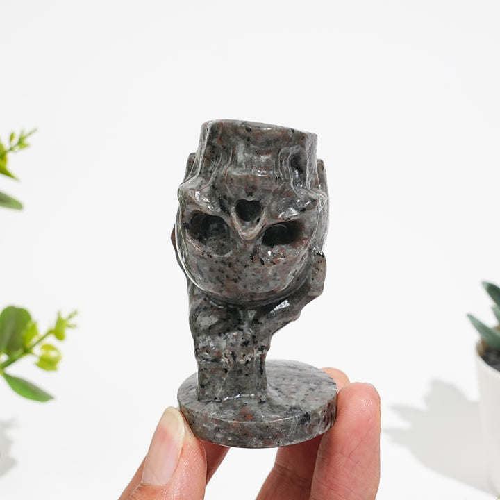 Natural Crystal Hand Holding Upside-Down Skull Carving