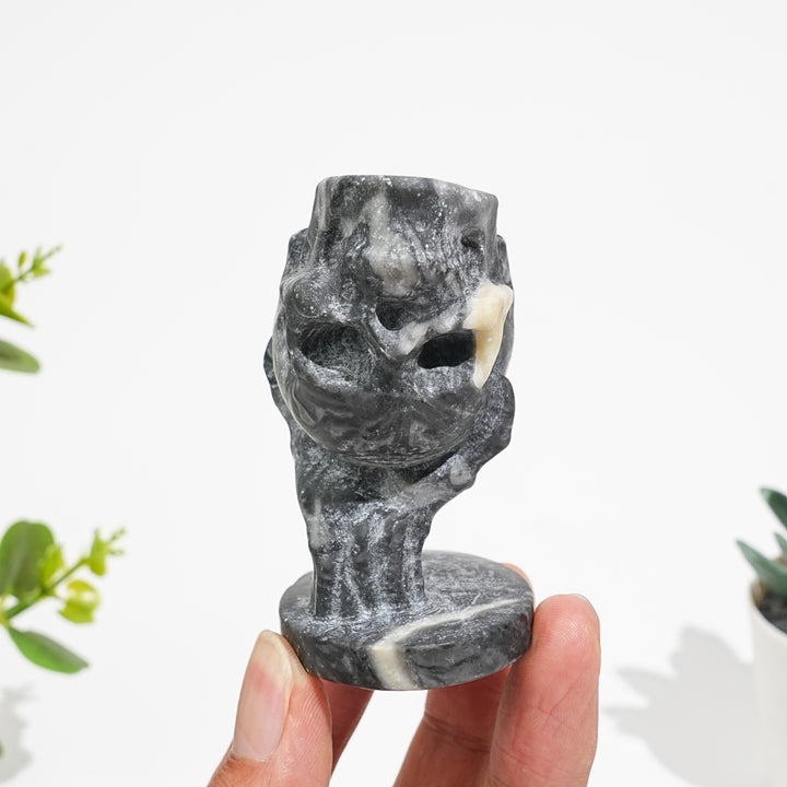Natural Crystal Hand Holding Upside-Down Skull Carving