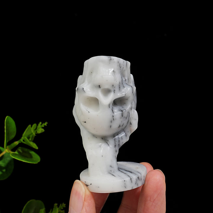 Natural Crystal Hand Holding Upside-Down Skull Carving