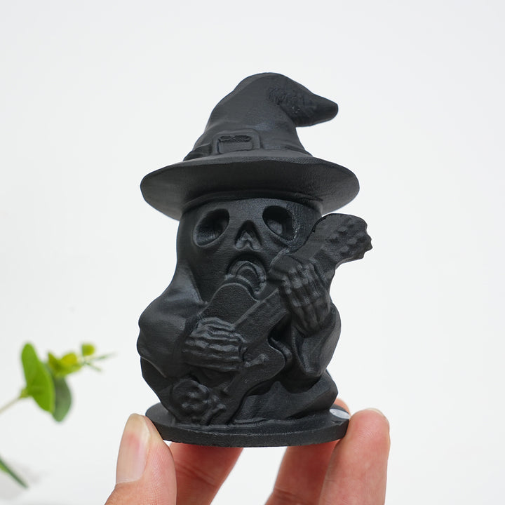 A Slightly Imperfect Natural Crystal Black Obsidian Guitar Playing Skull