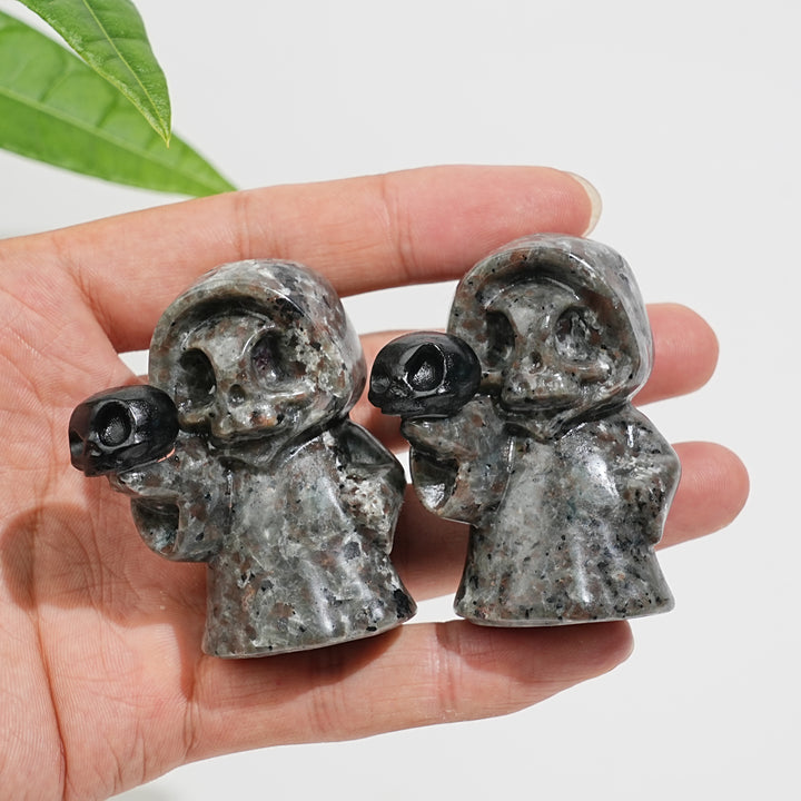 Natural Yooperlite Ghost Holding Skull Carving