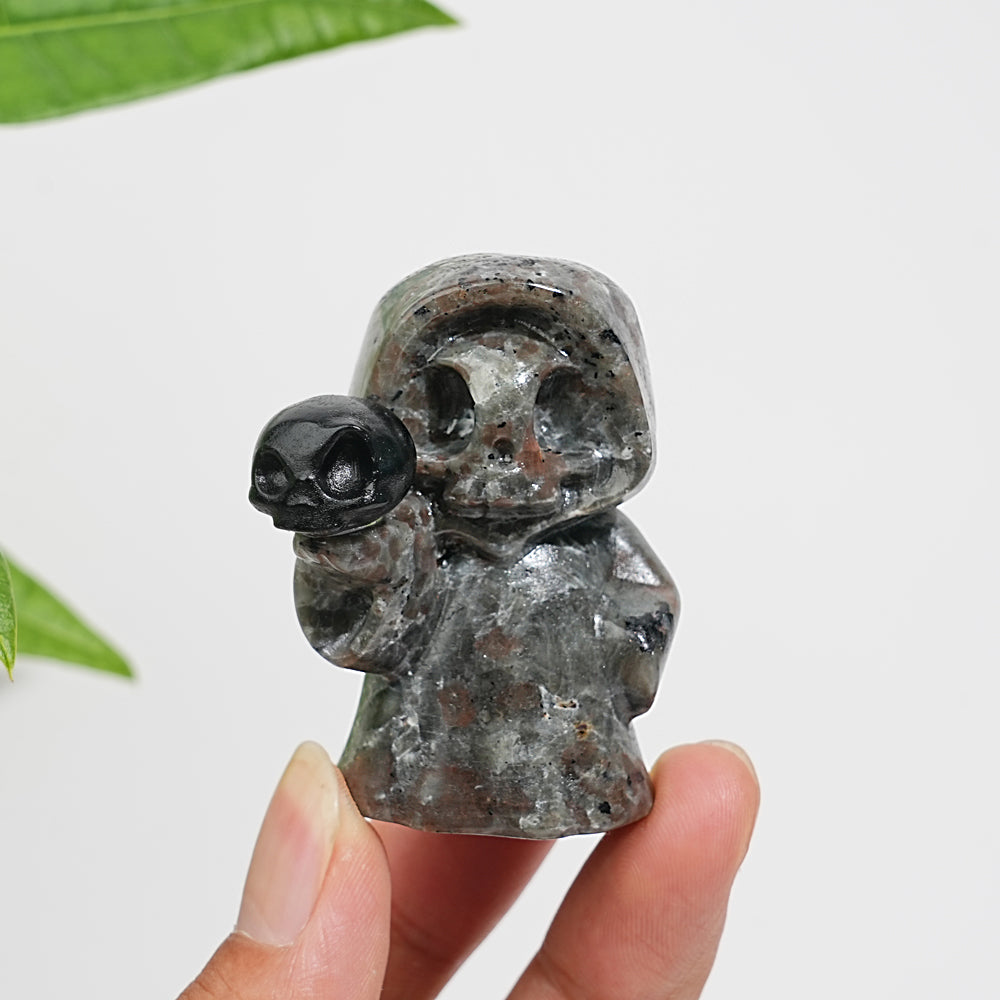 Natural Yooperlite Ghost Holding Skull Carving