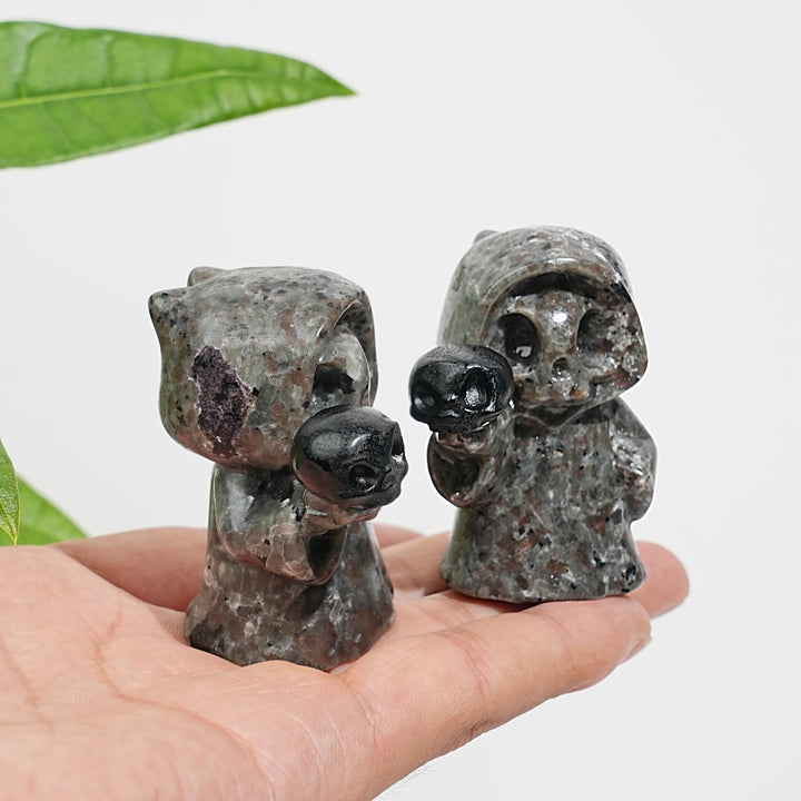 Natural Yooperlite Ghost Holding Skull Carving