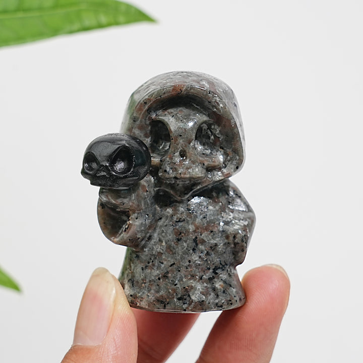 Natural Yooperlite Ghost Holding Skull Carving