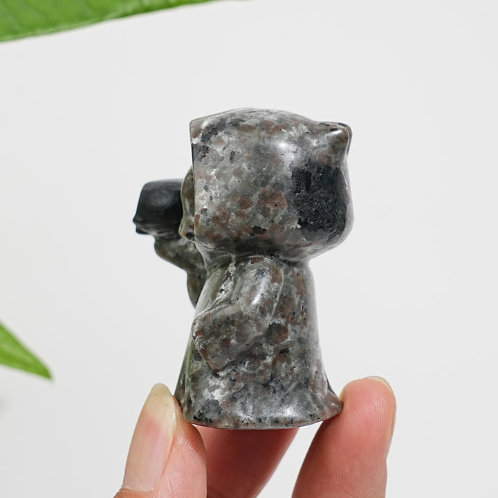 Natural Yooperlite Ghost Holding Skull Carving