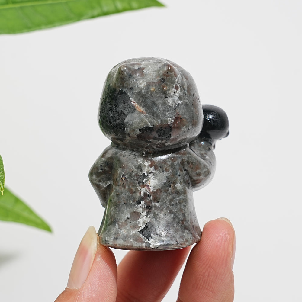 Natural Yooperlite Ghost Holding Skull Carving
