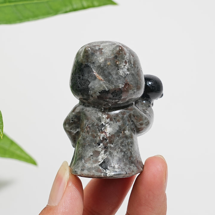 Natural Yooperlite Ghost Holding Skull Carving