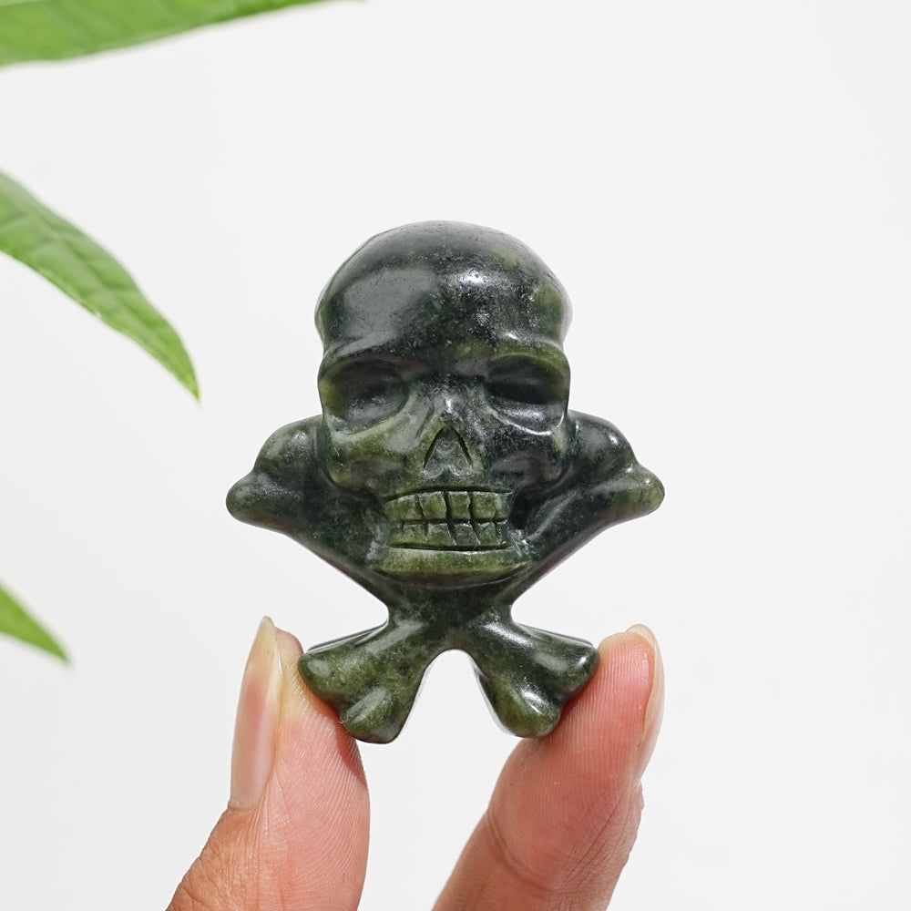 Natural Crystal Skull With Crossbone Carving