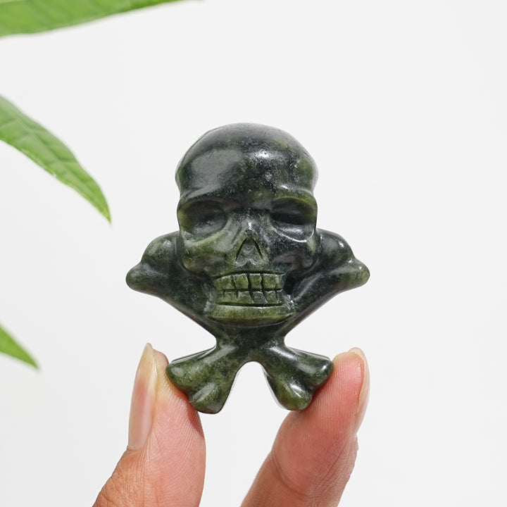 Natural Crystal Skull With Crossbone Carving