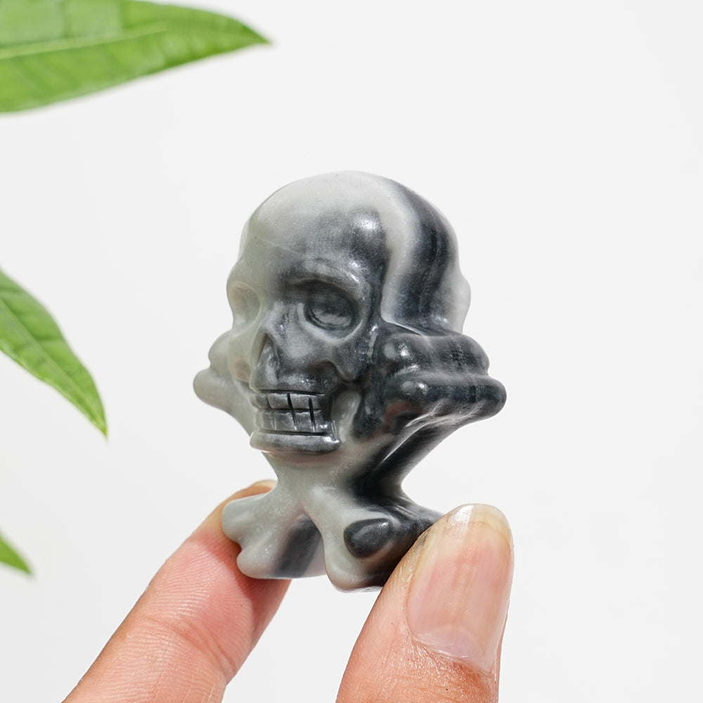 Natural Crystal Skull With Crossbone Carving