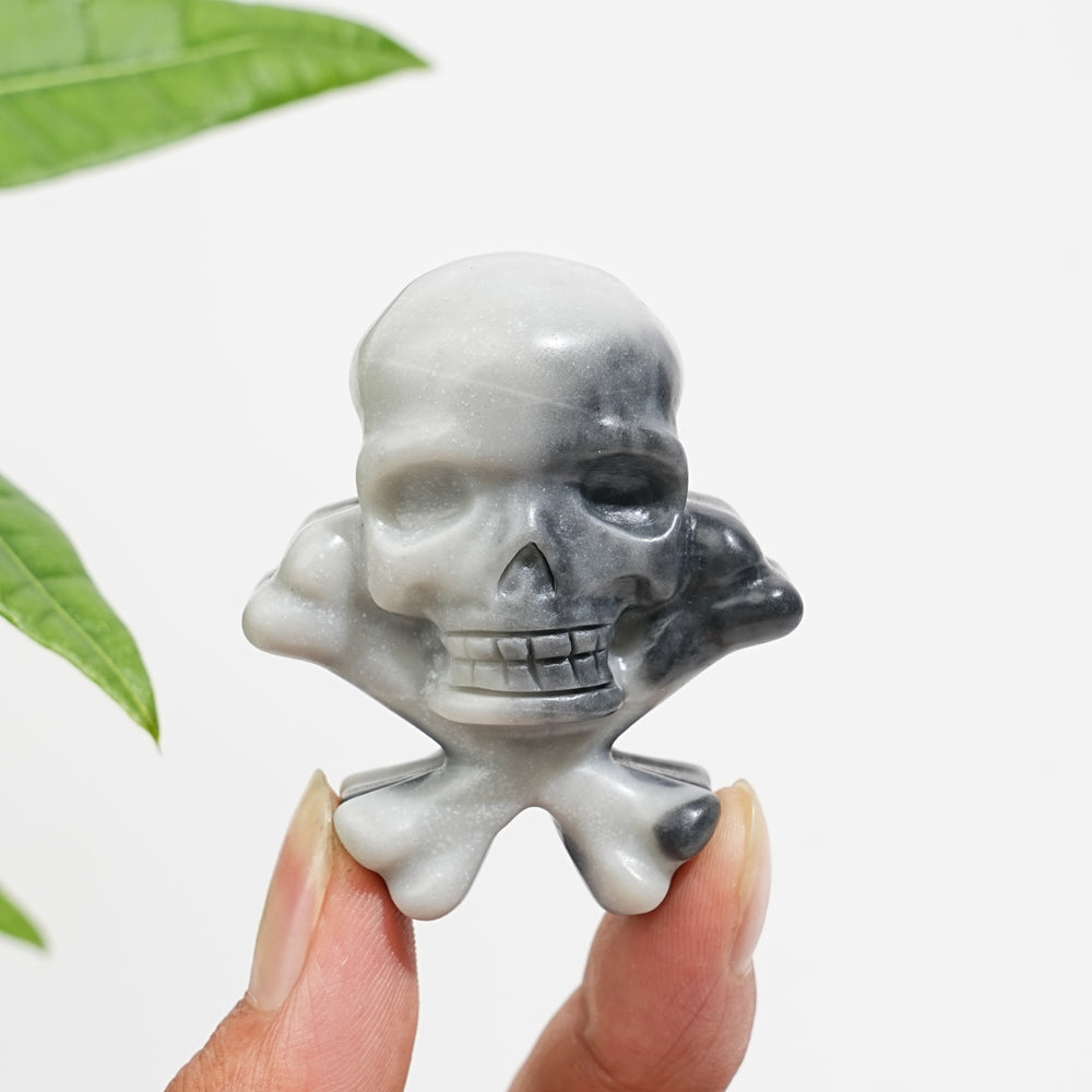 Natural Crystal Skull With Crossbone Carving