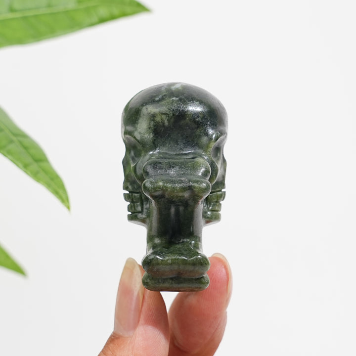 Natural Crystal Skull With Crossbone Carving