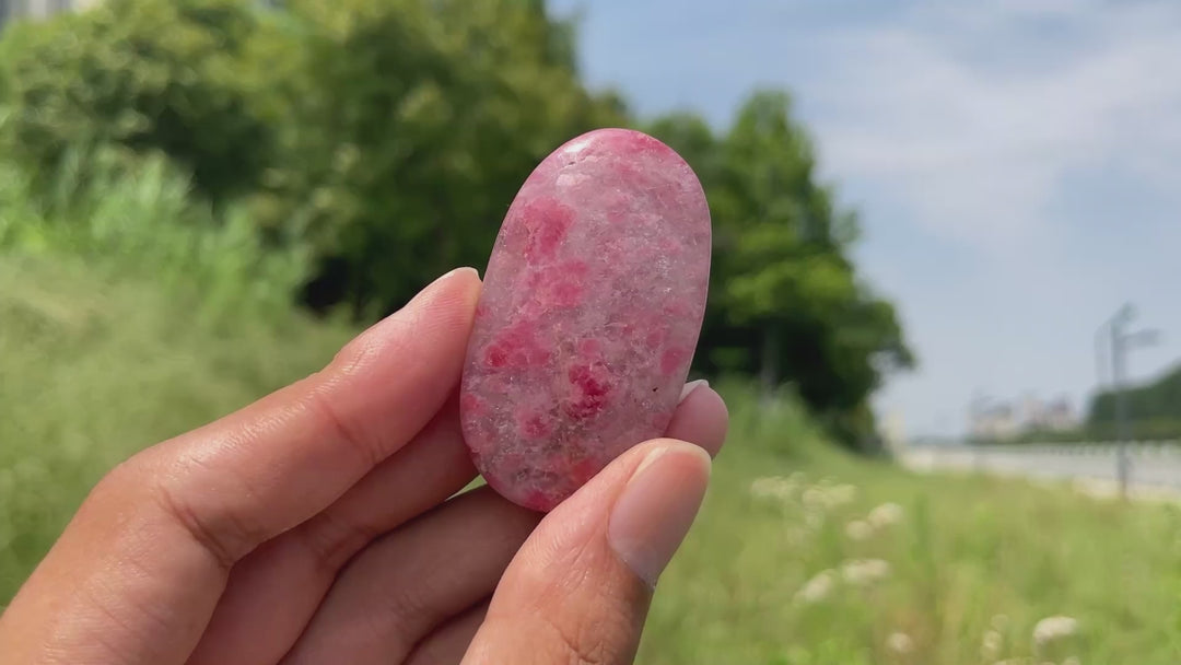 Natural Rhodonite In Quartz Palm Stone