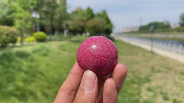 Natural Rhodonite In Quartz Sphere